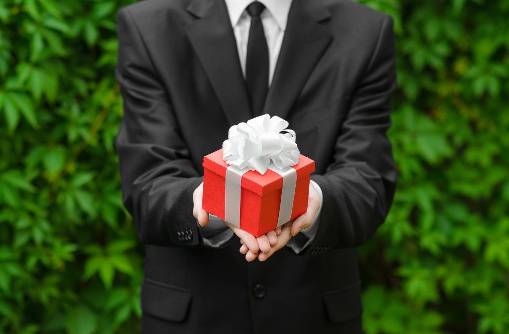 man holding a gift