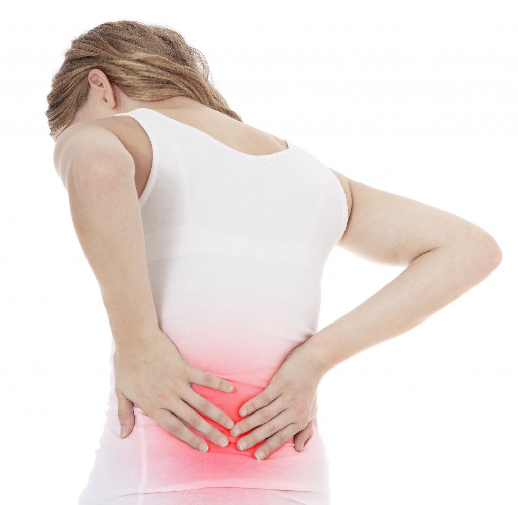 woman experiencing lower back pains