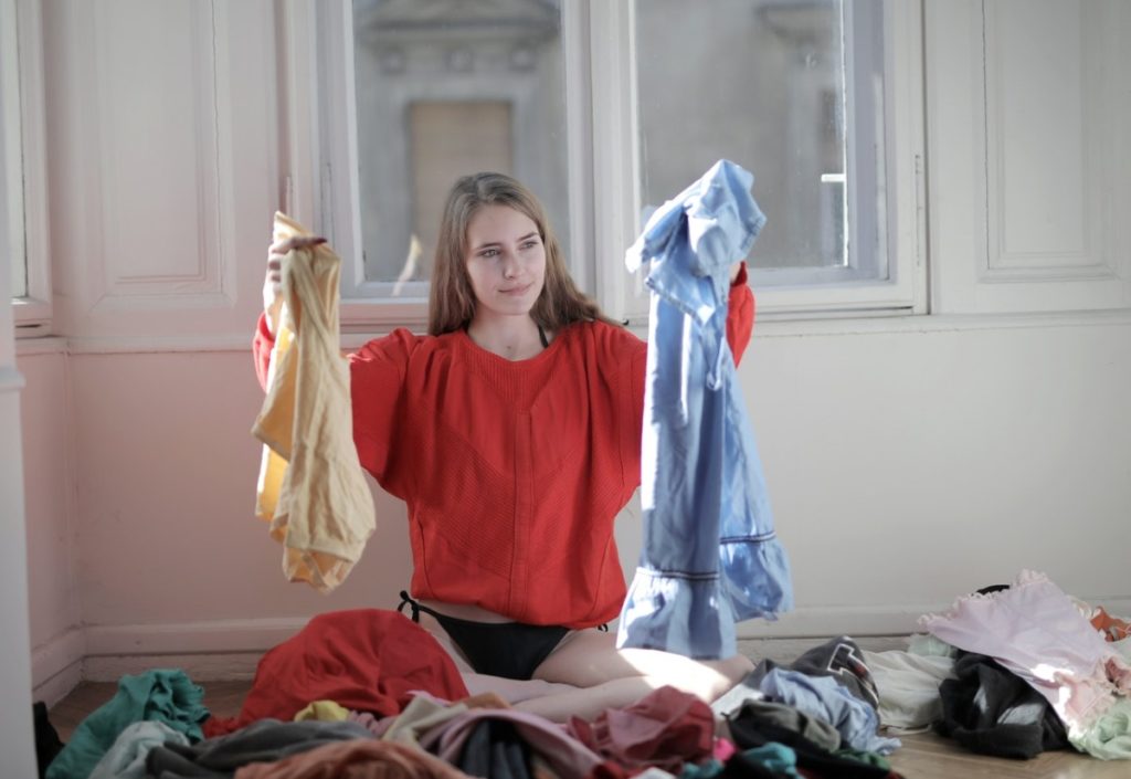 woman holding clothes