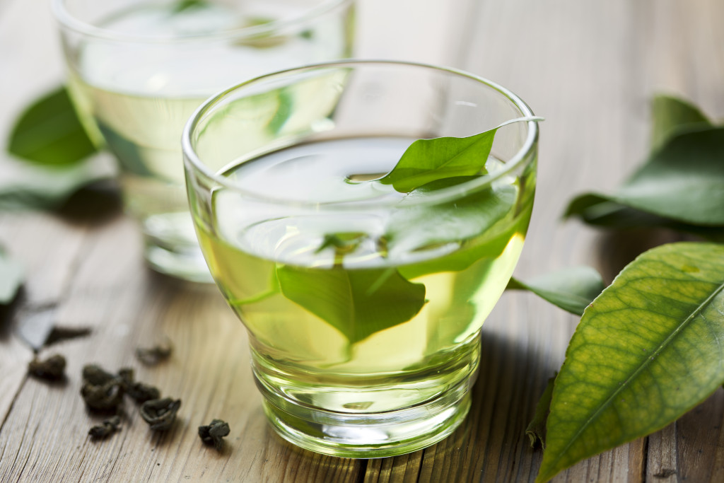 Portrait of a green tea with leave on the table